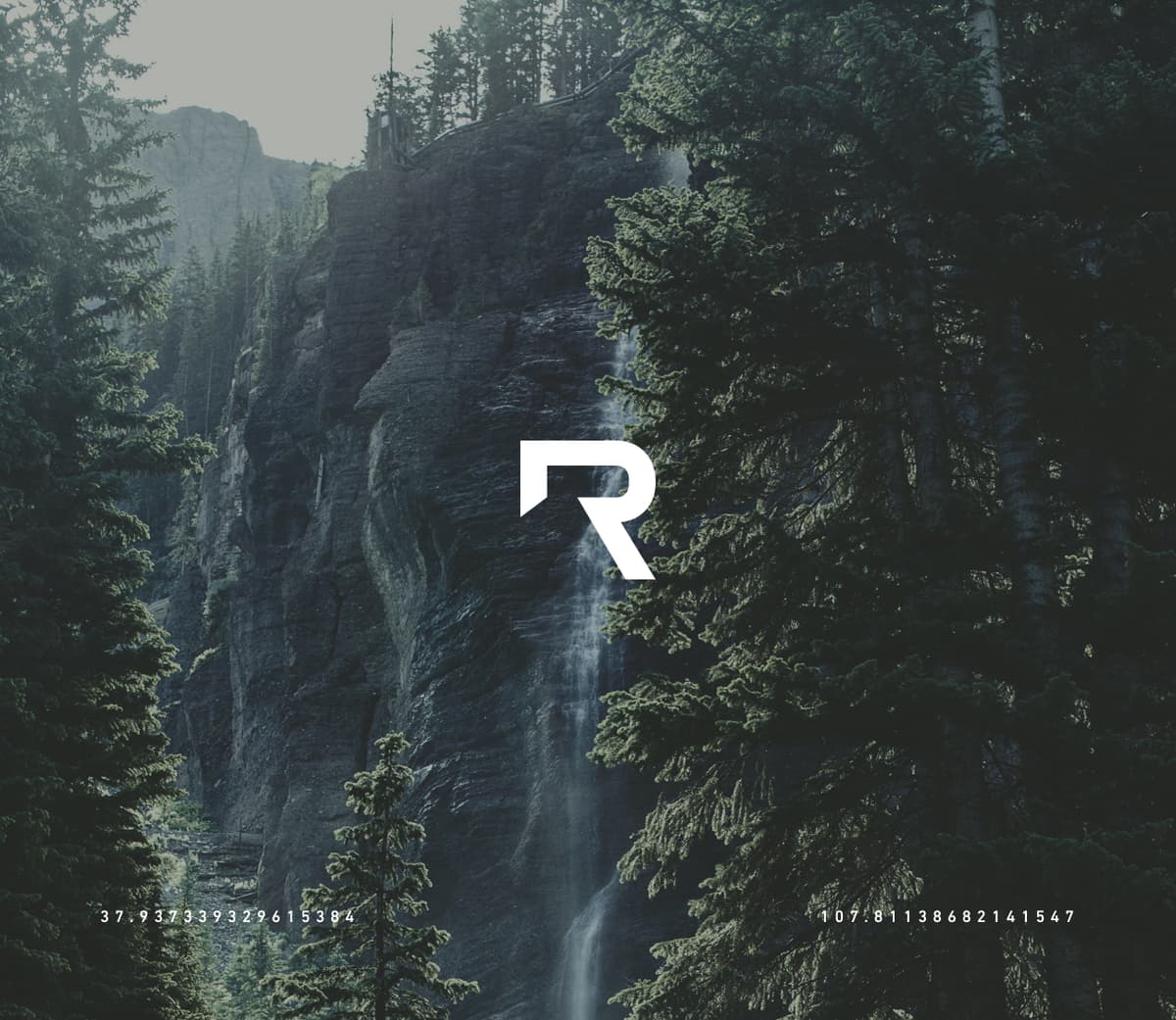 RESET logo and identity showing the logo over a dramatic moutain landscape of trees and a waterfall